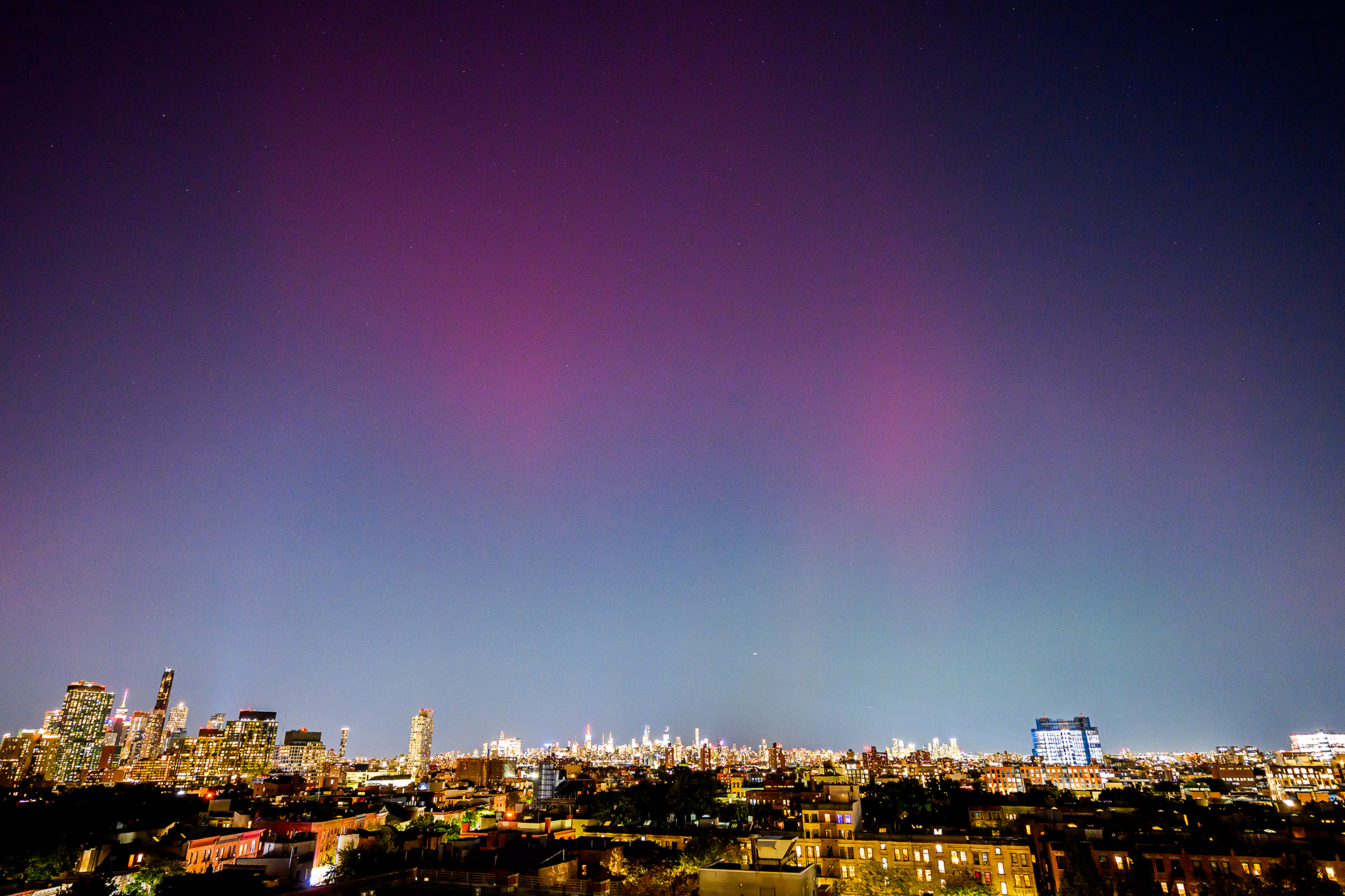 NEW YORK, NEW YORK - OCTOBER 11: The Northern Lights or Northern Lights are visible over the New York skyline on October 11, 2024 in New York City. (Photo by Roy Rochlin/Getty Images)