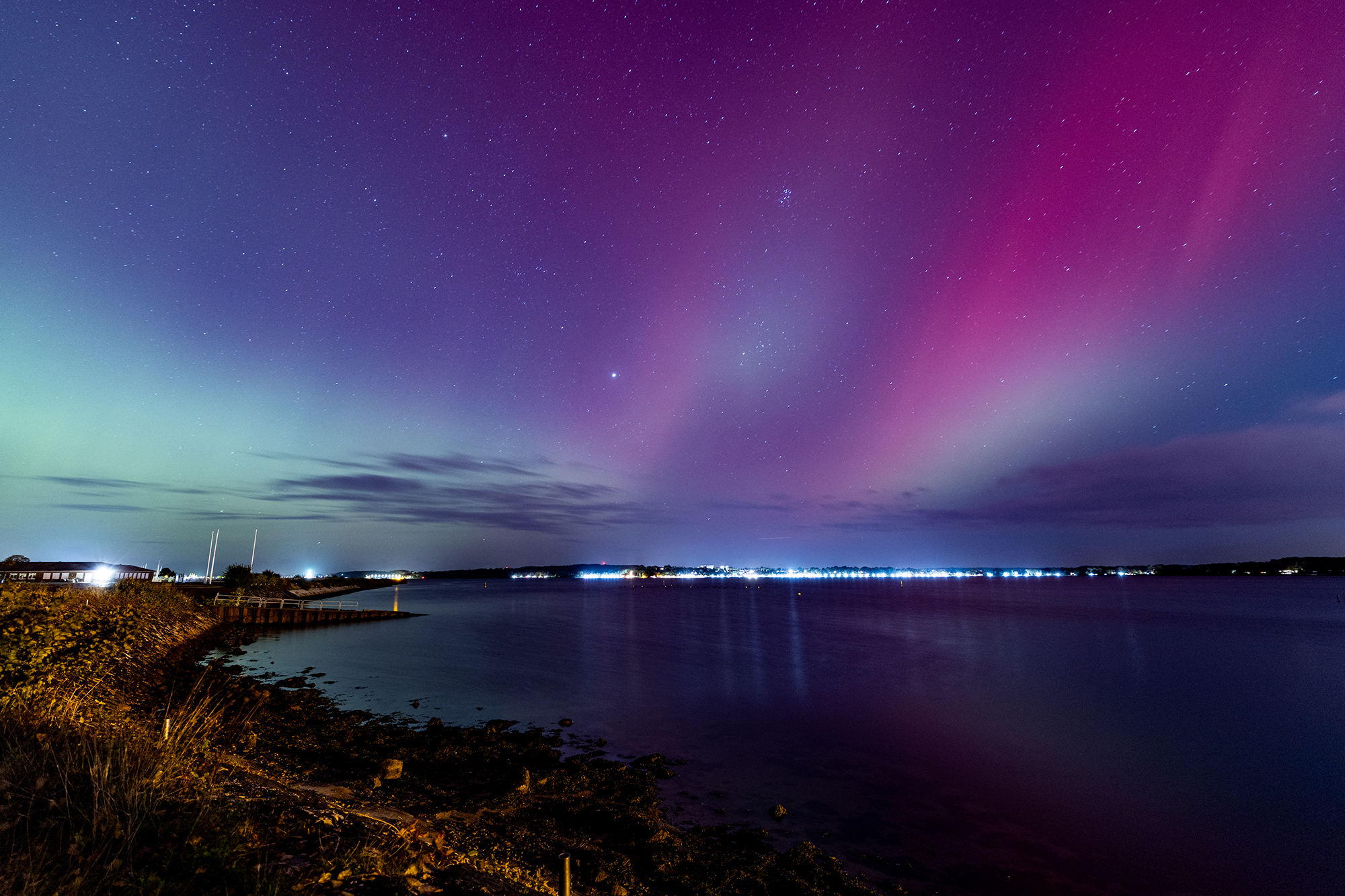 Northern lights (Aurora Borealis) are seen over the Baltic Sea close to Kiel, northern Germany, on October 10, 2024. (Photo by Axel Heimken / AFP) (Photo by AXEL HEIMKEN/AFP via Getty Images)