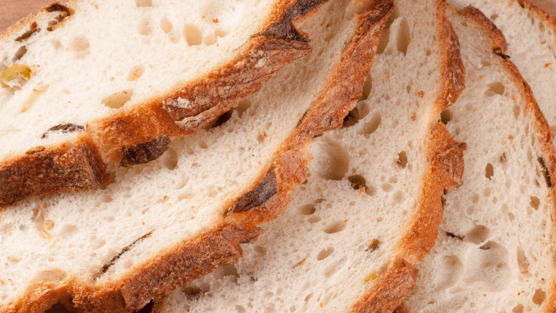 a close up of four pieces of sliced bread