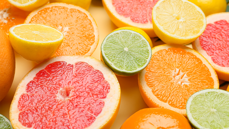 cut oranges, grapefruits, limes, and lemon together in a group