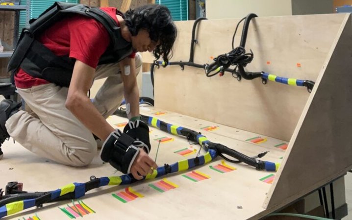 Researcher testing sensors and weights for fatigue monitoring