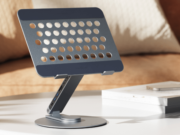 A laptop hub stand sitting on a desk