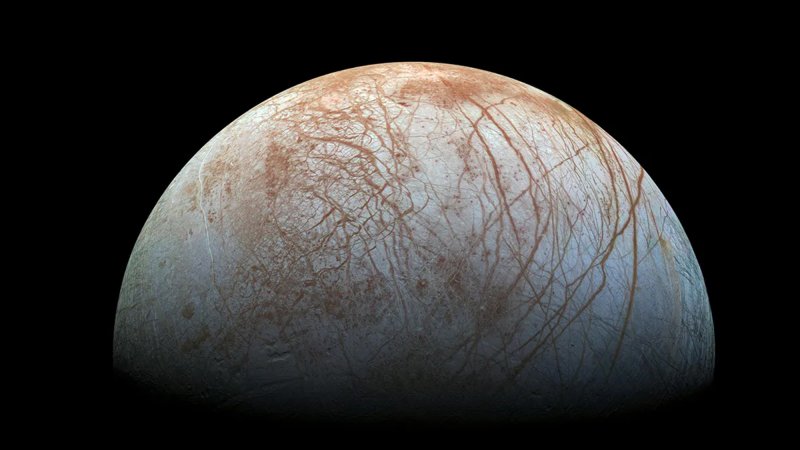 The surface of Europa – one of Jupiter’s moons – is a thick layer of solid ice.