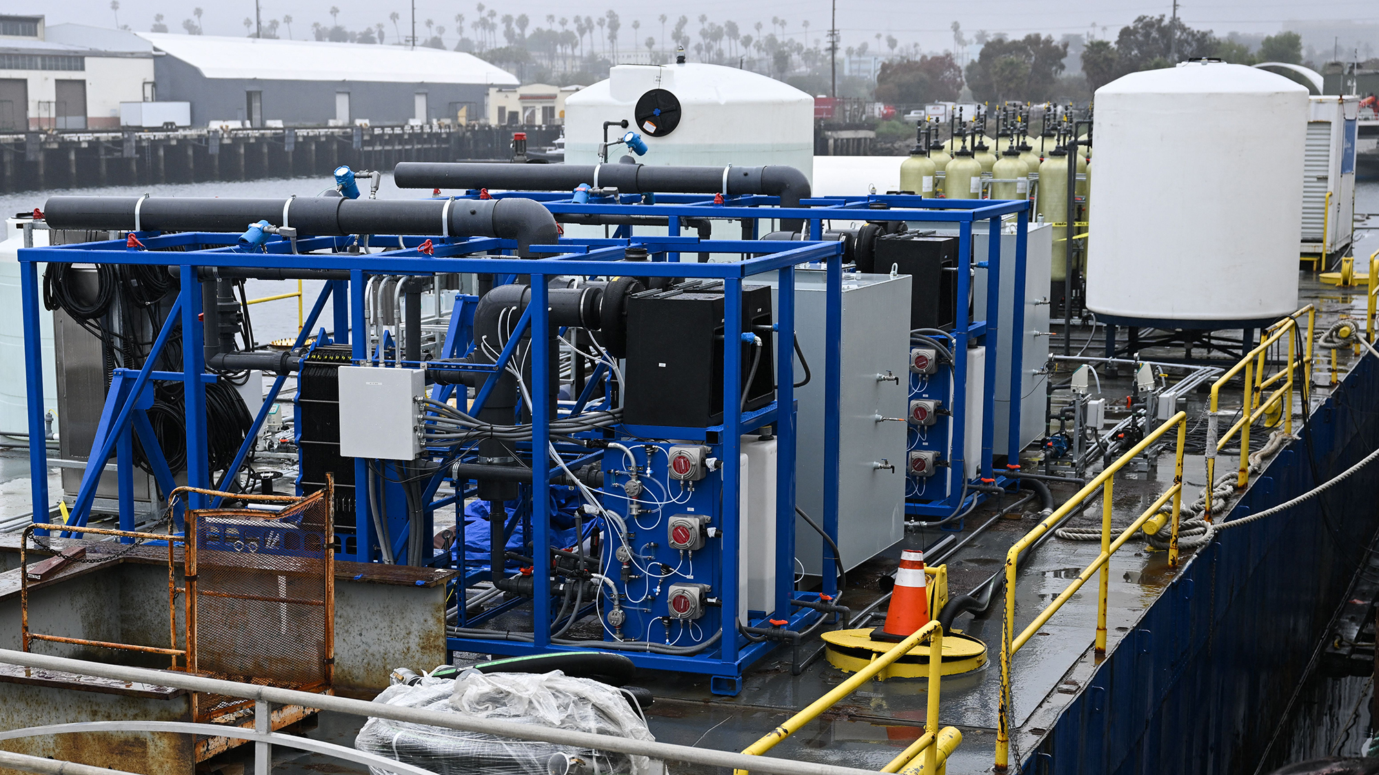 Equipment including an electrochemical reactor where seawater is split via electrolysis to capture carbon on a barge for UCLA's SeaChange climate change carbon removal project at the Port of Los Angeles in San Pedro, California on April 12, 2023. The project is now known as Equatic.