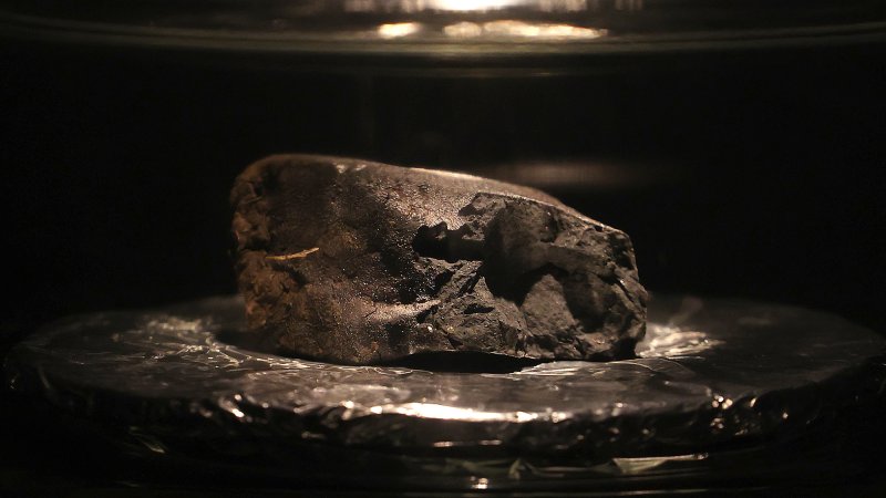 The Winchcombe meteorite sits on display at the Natural History Museum on May 13, 2021 in London, England. The meteorite is a rare type, the first to fall in 30 years.