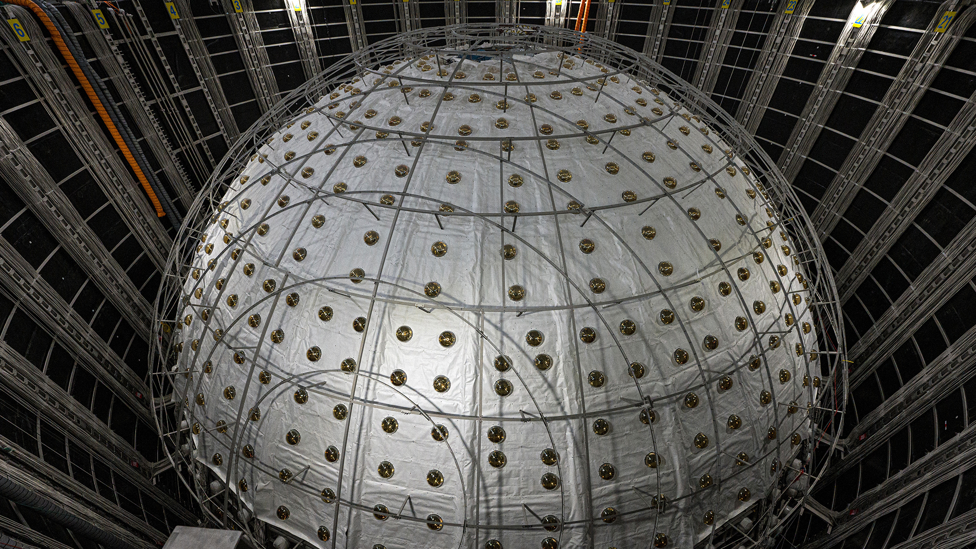 This photo taken during a media tour on October 11, 2024 shows the neutrino detector, a stainless steel and acrylic sphere around 35 meters in diameter, at the Jiangmen Underground Neutrino Observatory (Juno) in Kaiping, in southern China's Guangdong province.