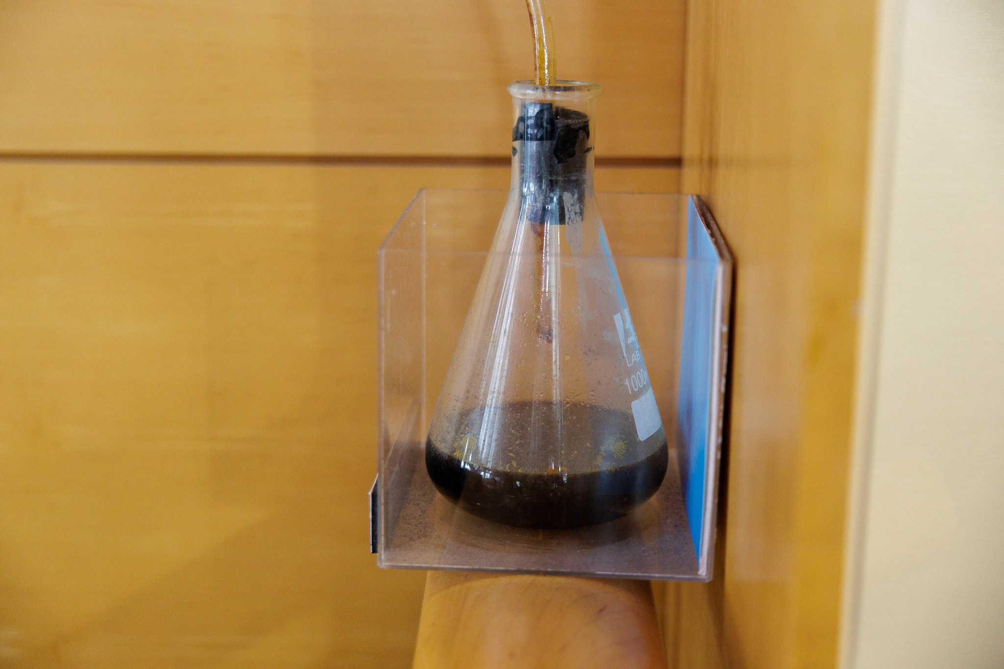 a flask collecting dark brown oil