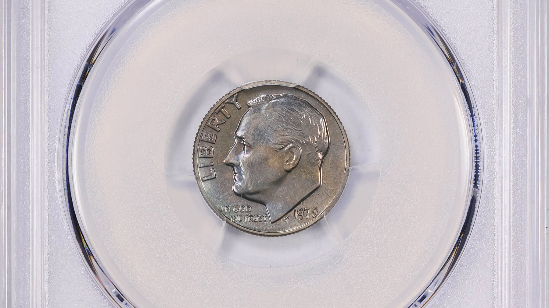 a rare dime in a protective case. it is missing the “S” that indicates it was struck at the San Francisco mint.