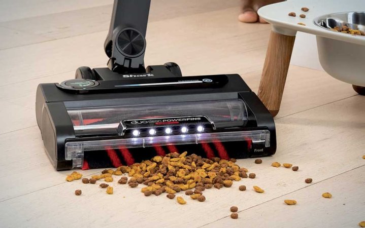 A Shark⁢ Stratos vacuum cleaning‍ up pet food