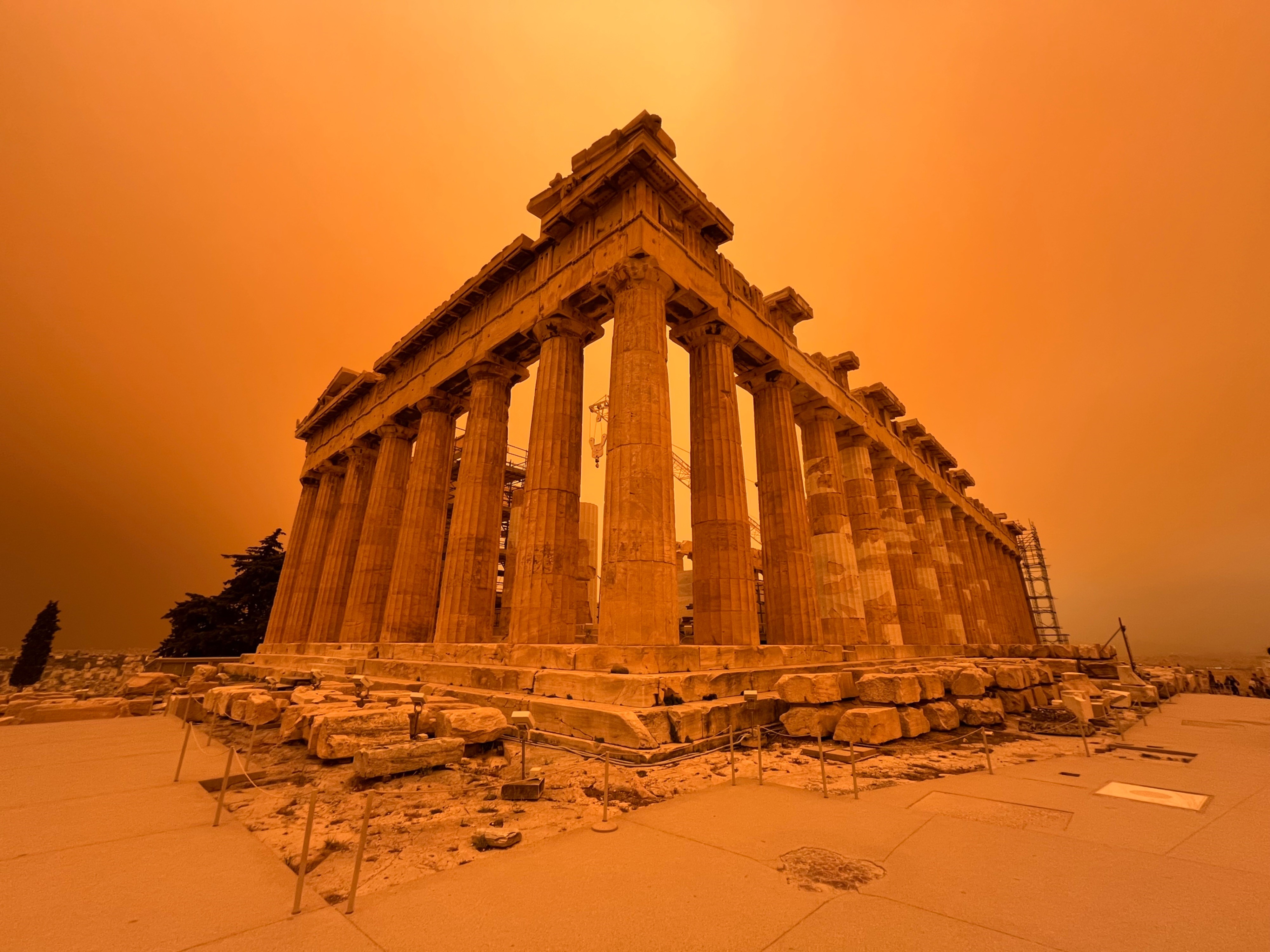 columns and ruins seen in hazy orange light