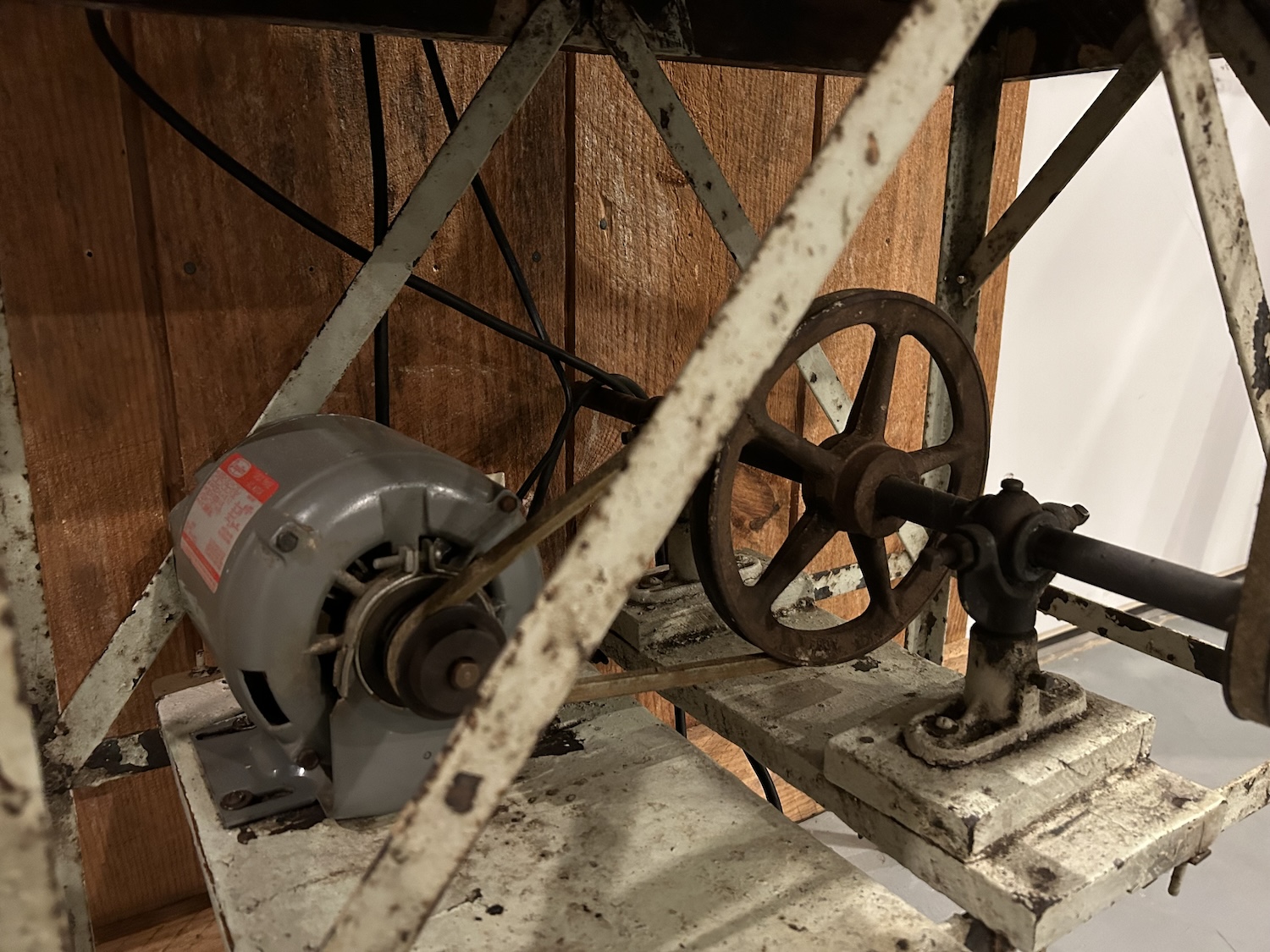 A motor attached to the beaten biscuit maker