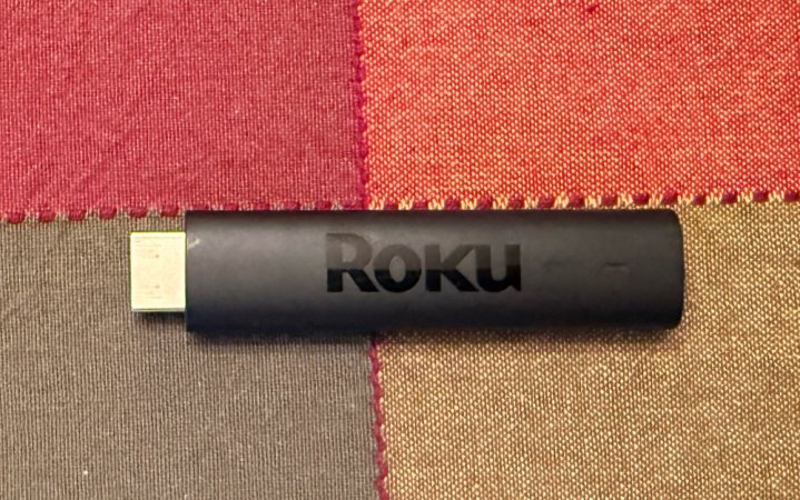  Roku Streaming Stick 4K on a patterned tablecloth.