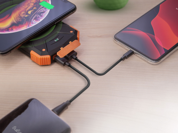 Multiple phones charging using one portable charger.