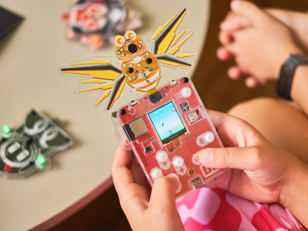 A person playing with a DIY gaming kit