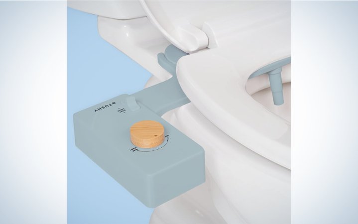  Tushy Bidet in blue attached to a toilet