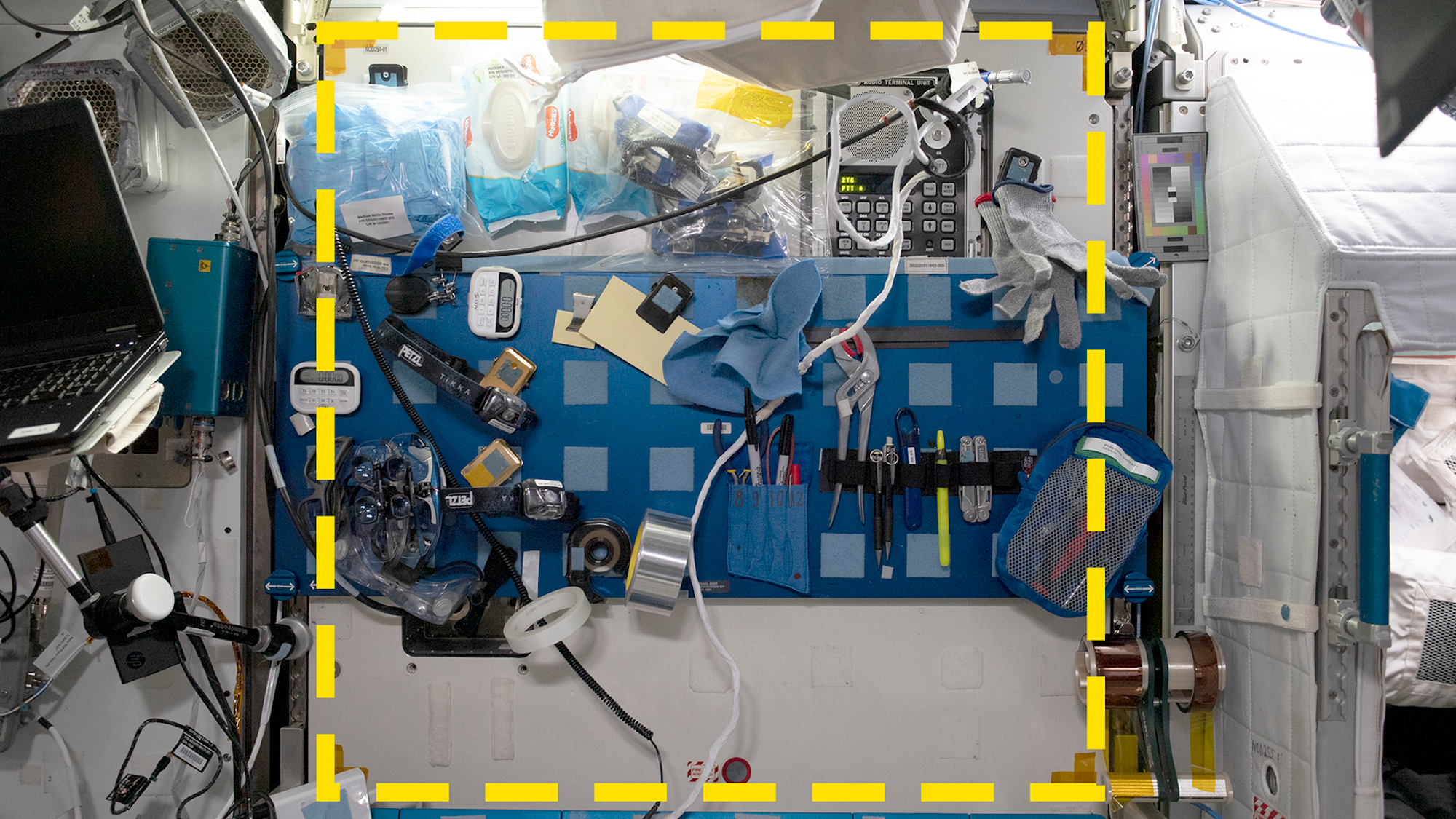 A sample location in the starboard Maintenance Work Area of the International Space Station. The yellow dotted line indicates the boundaries of the sample area. CREDIT: NASA / ISSAP