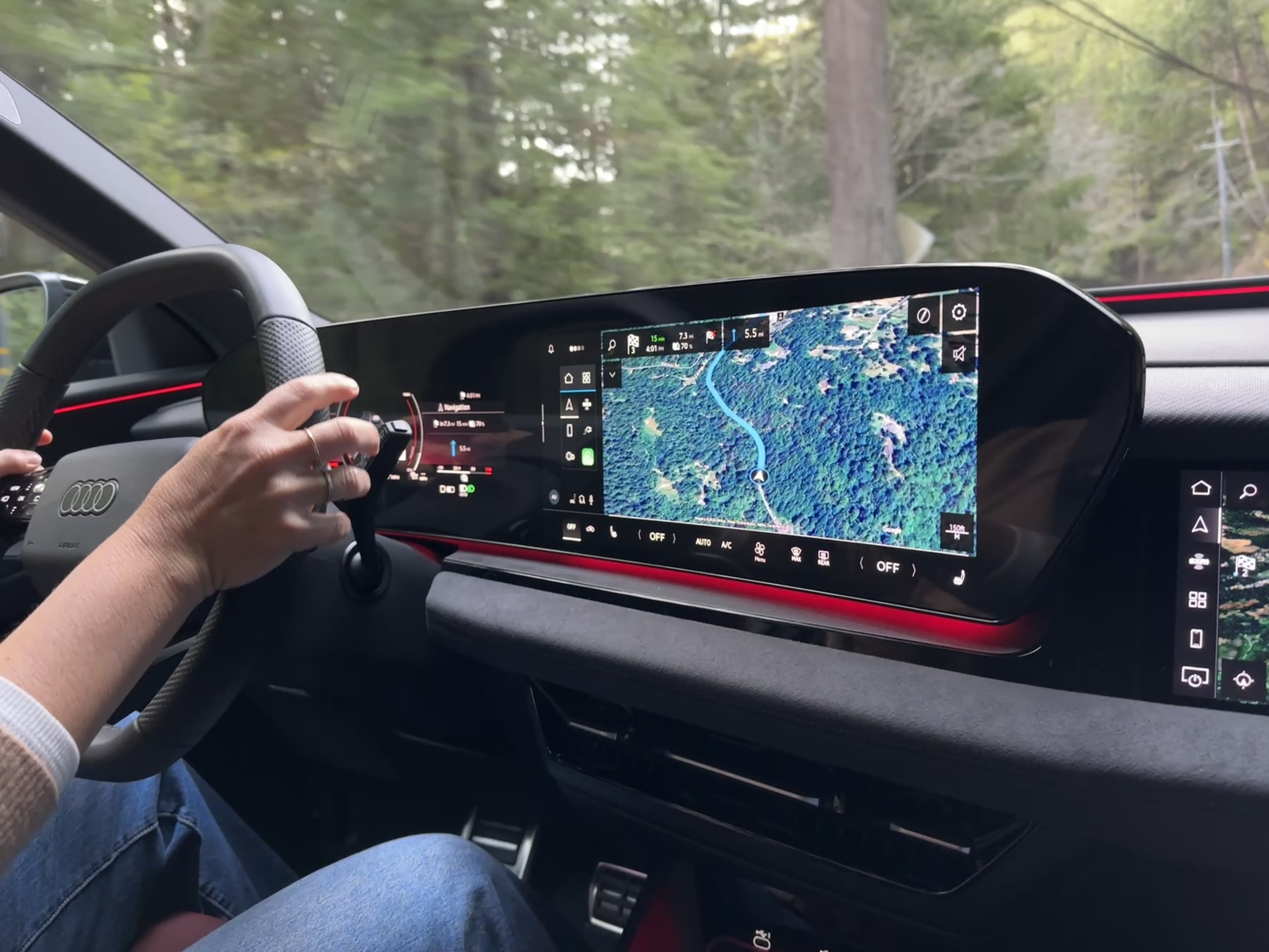 hands on a steering wheel, infotainment center