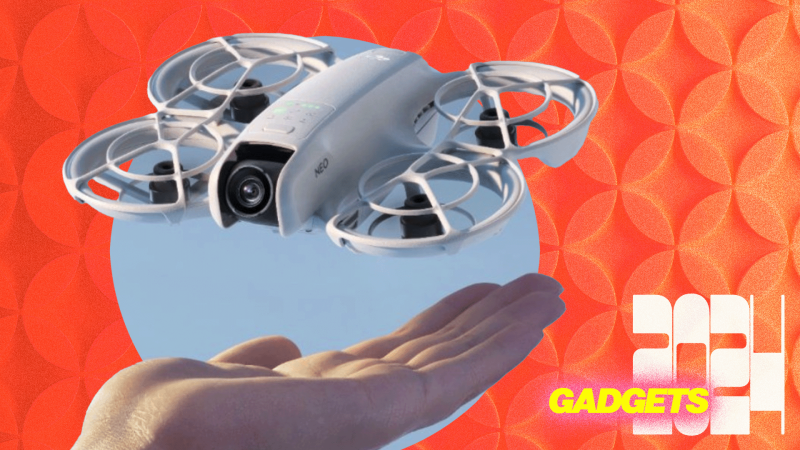  a hand holds a small drone