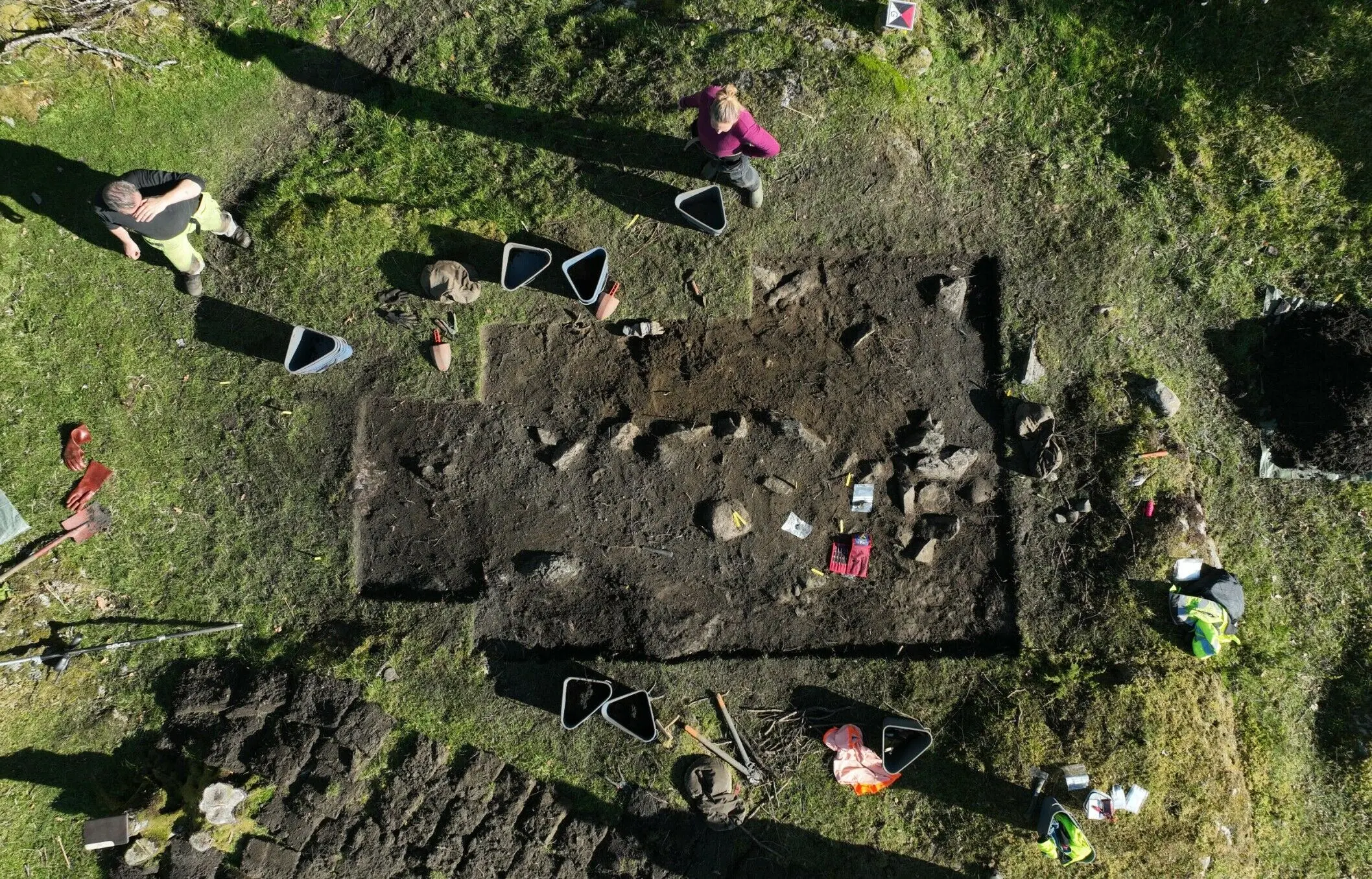 Viking women gravesites unearthed to find jewelry, coins, and a ‘vulva stone’