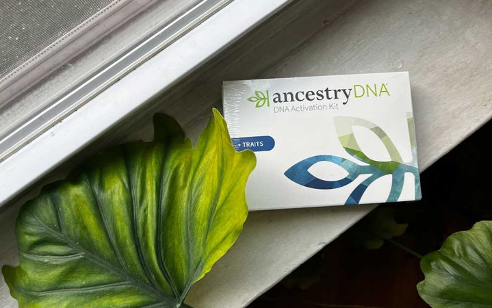 An AncestryDNA kit sitting on a windowsill.