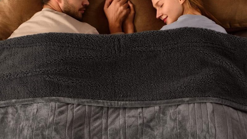 Bearhug heated blanket with two people sleeping under it