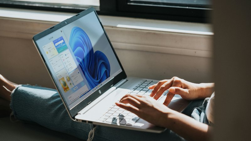 hands on a windows laptop