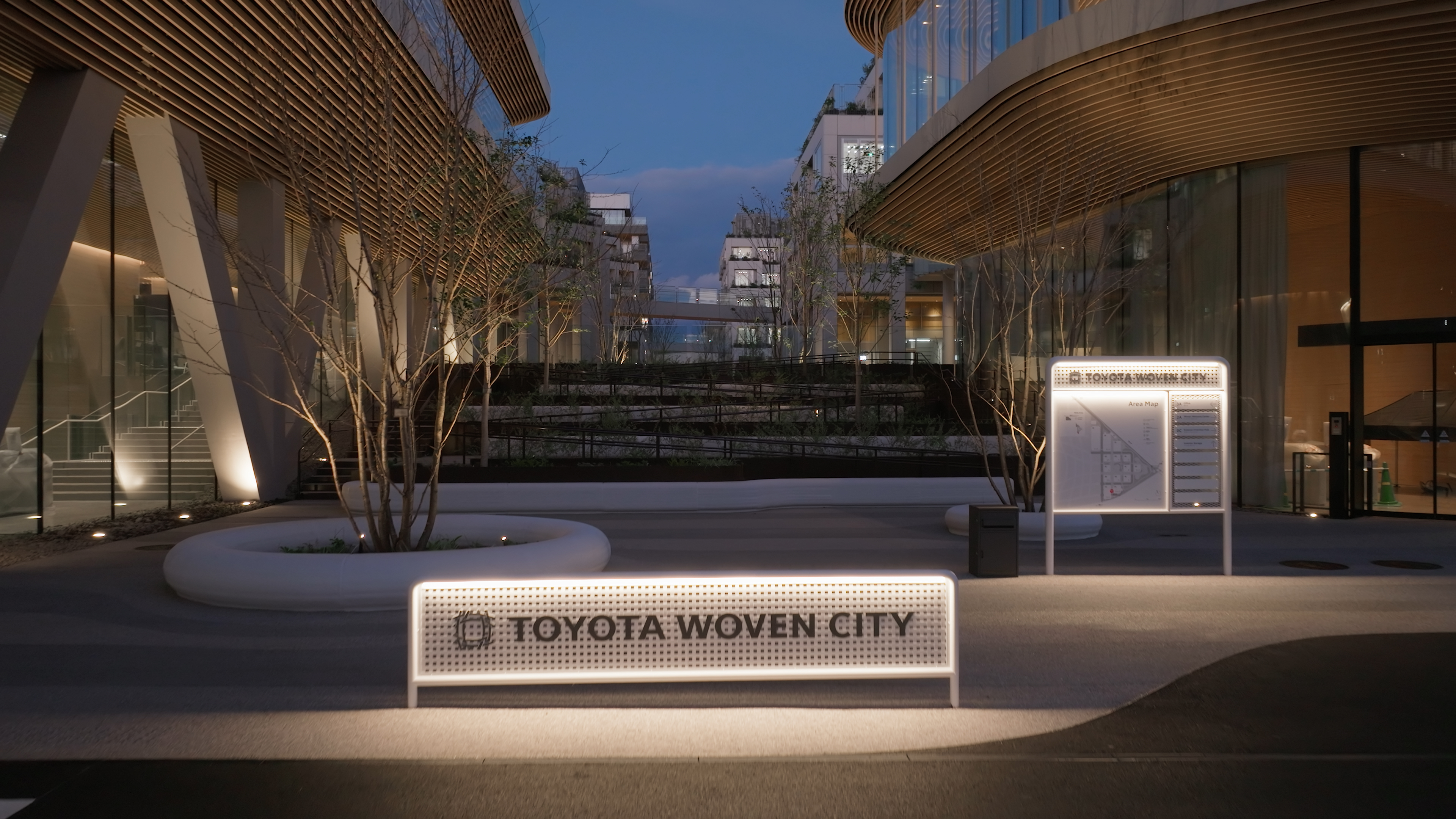 Walkway in Toyota's Woven City with city sign at forefront