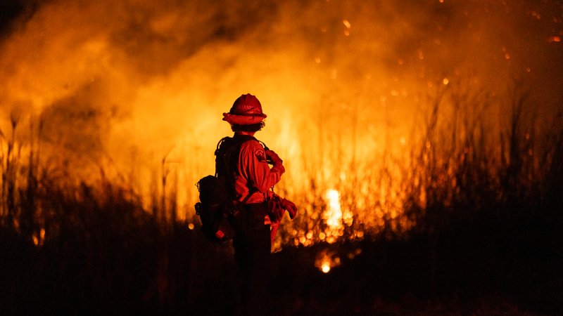 A firefighter monitors the spread of the Auto Fire in Oxnard, North West of Los Angeles, California, on January 13, 2025