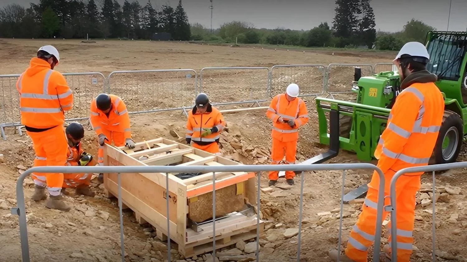 Workers excavating stone coffin