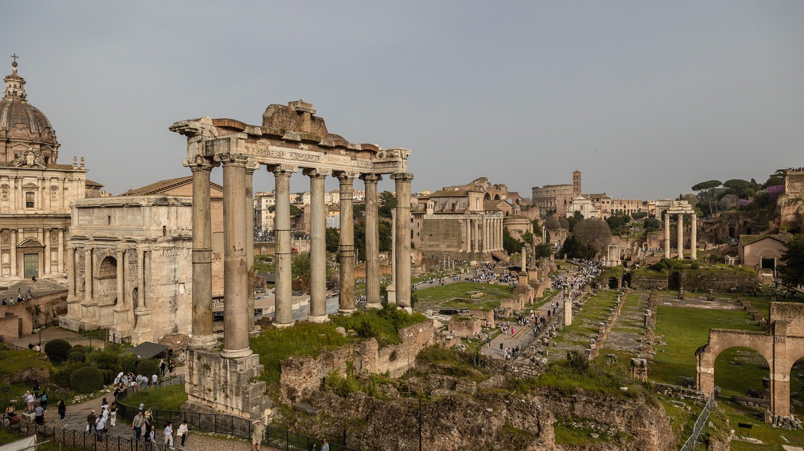 A general view of (L-R) the church of Santi Luca e Martina, the Arch of Septimius Severus, the ruins of the Temple of Saturn and - in the background - the Amphitheatrum Flavium, commonly known as Colosseum (in Italian: Colosseo), on March 31, 2024 in Rome, Italy.