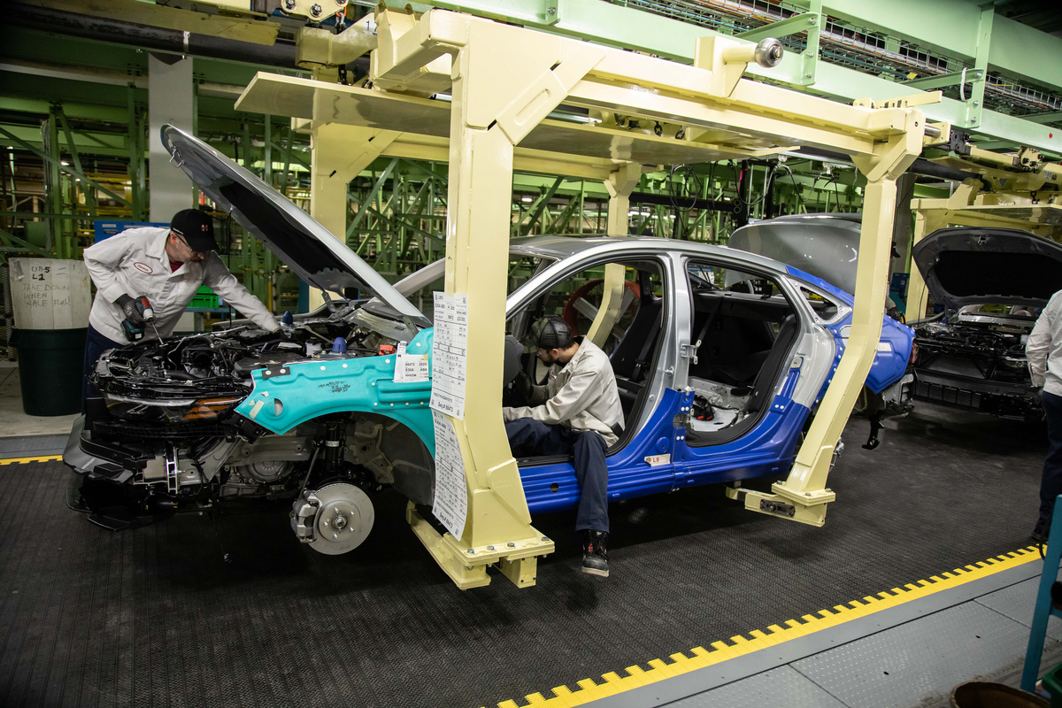 technicians working on assembly line