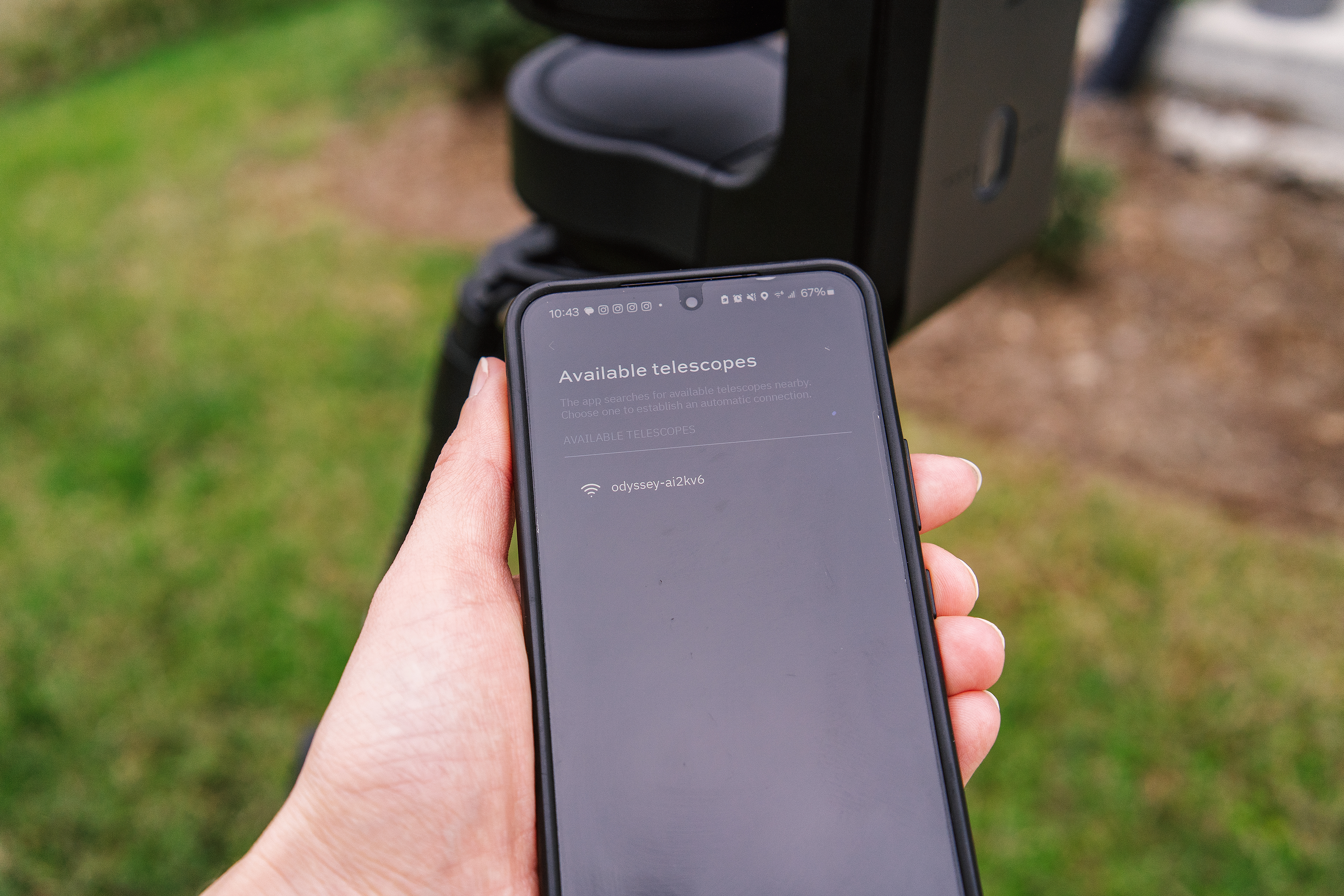 The Wi-Fi connection screen of the Unistellar Odyssey Pro smart telescope app shown on the screen of a smartphone held in the author's hand