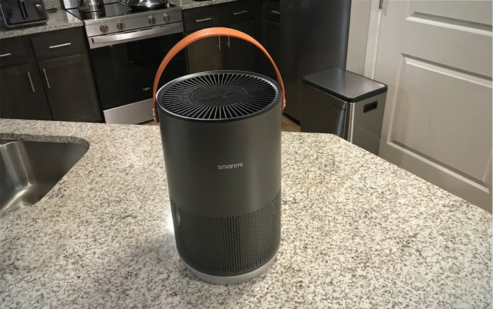  Cylindrical gray Smartmi portable air purifier sitting on a kitchen counter